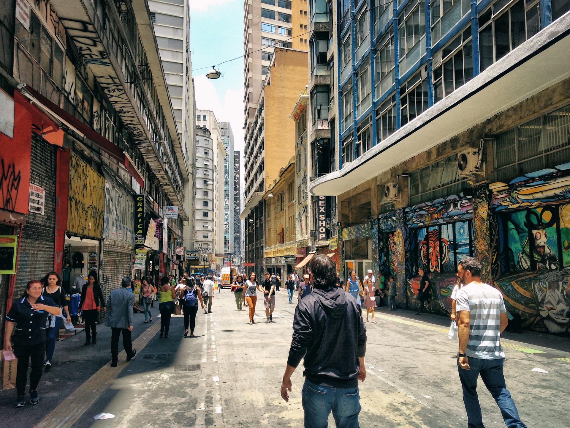 Pedestrians walking through a commercial street in São Paulo, Brazil.